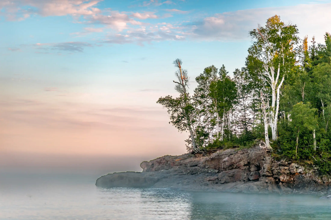 picture of the North Shore in Minneosta jutting out into Lake Superior against a clear blue sky