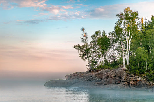 picture of the North Shore in Minneosta jutting out into Lake Superior against a clear blue sky